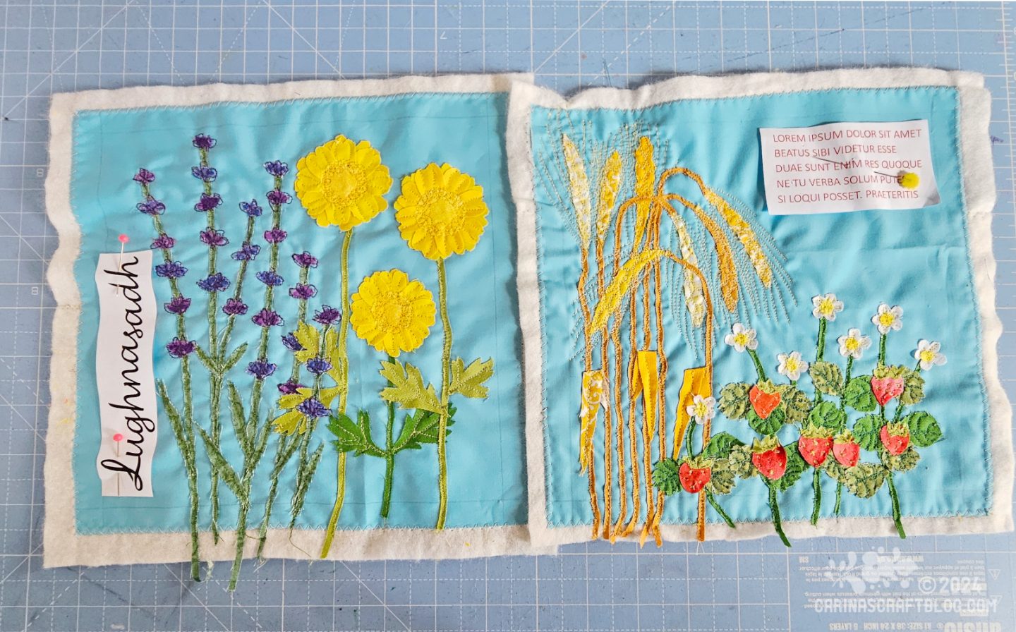 Overhead view of two aqua blue squares of fabric, on which are appliquéd different types of plants.